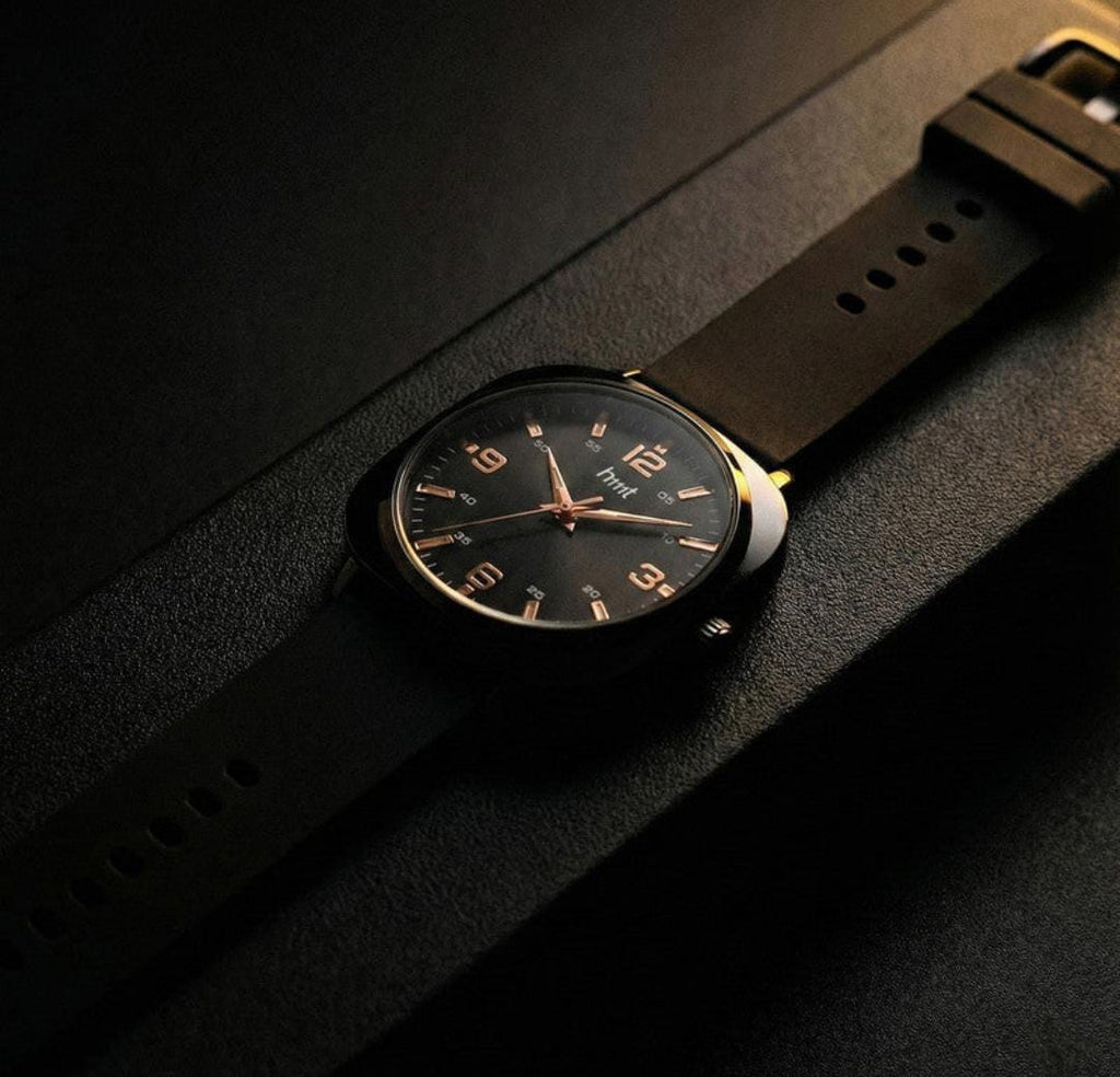 Classic analogue wrist watch with black dial and multi colour silicone strap for daily and casual wear.