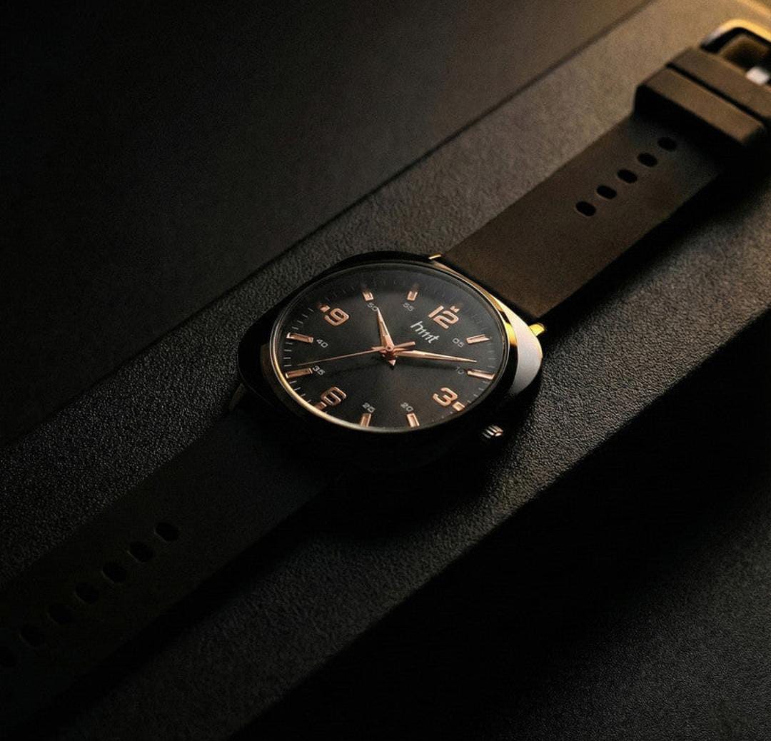 Classic analogue wrist watch with black dial and multi colour silicone strap for daily and casual wear.