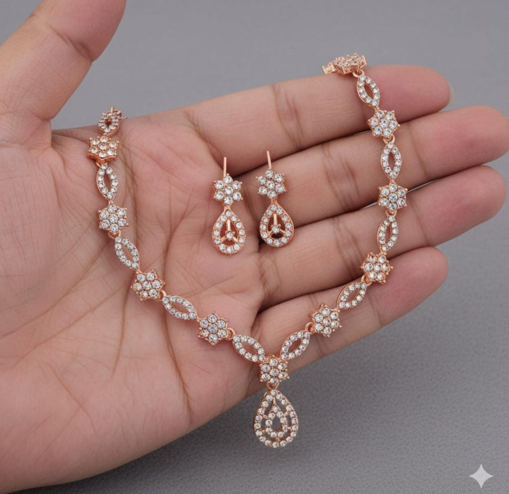Elegant crystal and enamel floral link Necklace set with pearl drop.