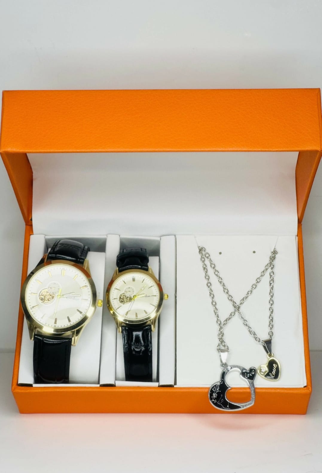 Luxury couple watch and pendant gift set- matching his and her classic Gold dial analogue watches with black and  silver 'Love' heart necklaces - romantic anniversary or valentine's gift in premium Orange box.