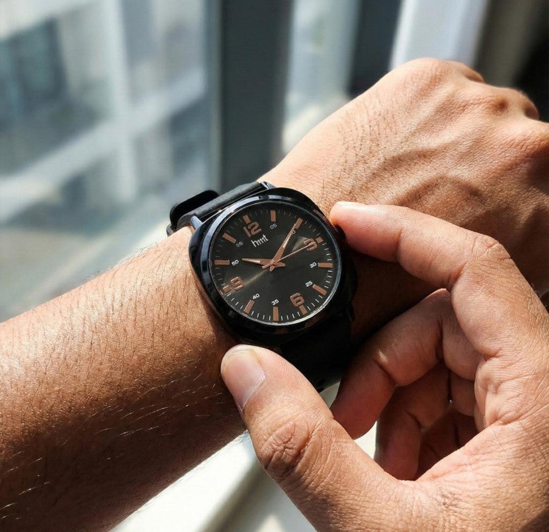 Classic analogue wrist watch with black dial and multi colour silicone strap for daily and casual wear.